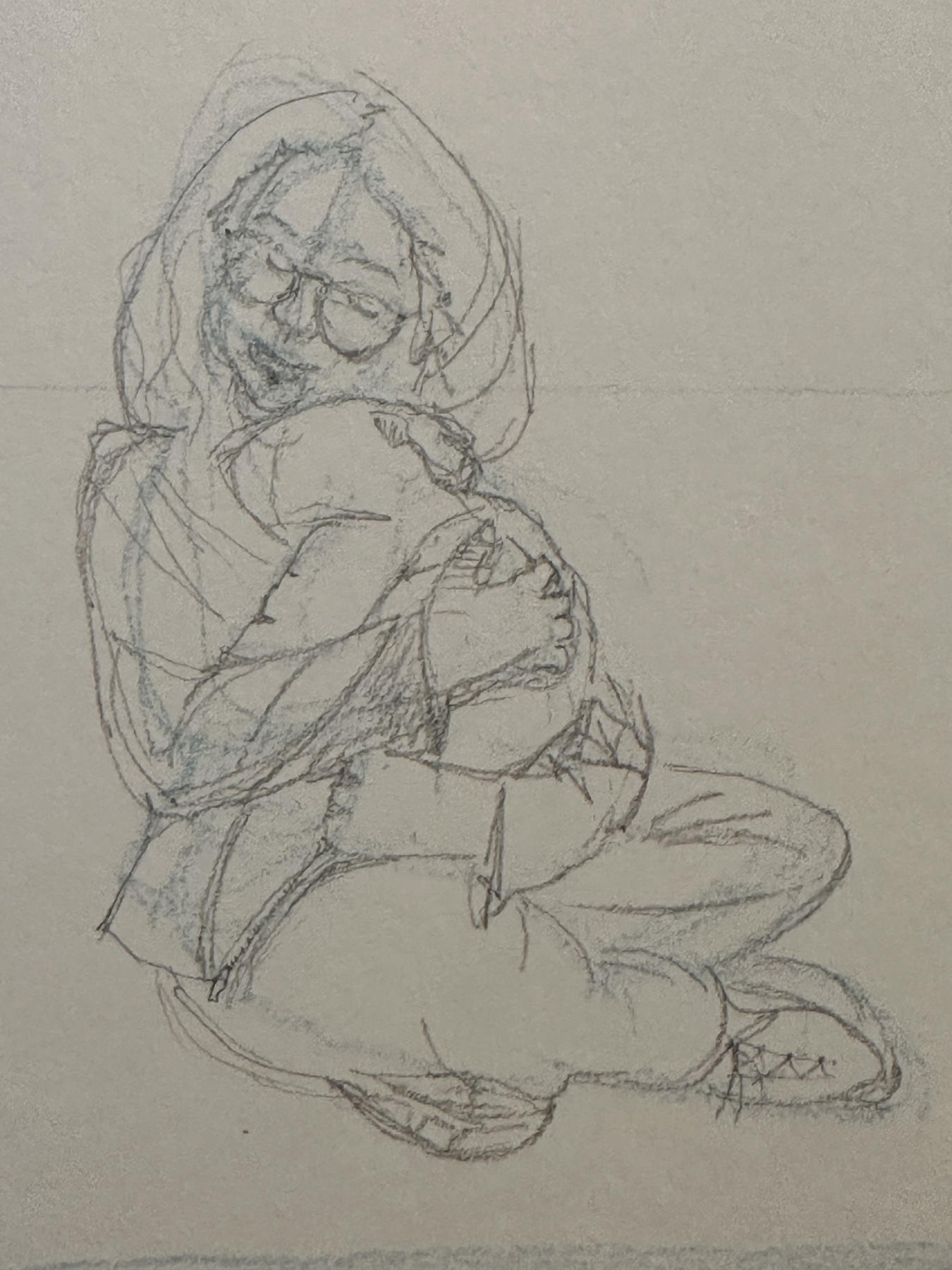 A pencil sketch depicts a person sitting cross-legged, wearing glasses, and affectionately holding a child swaddled in cloth