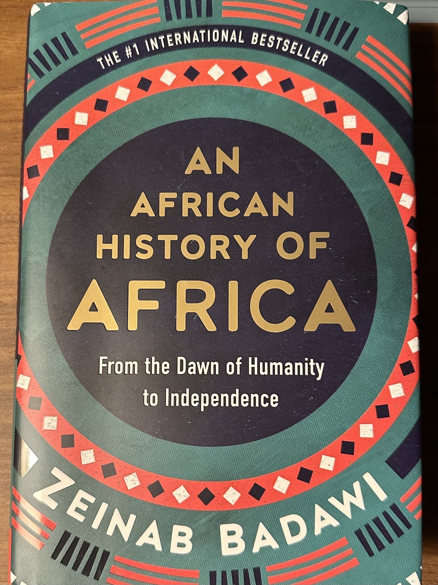 A book cover features the title "An African History of Africa" by Zeinab Badawi, describing the journey from the dawn of humanity to independence.