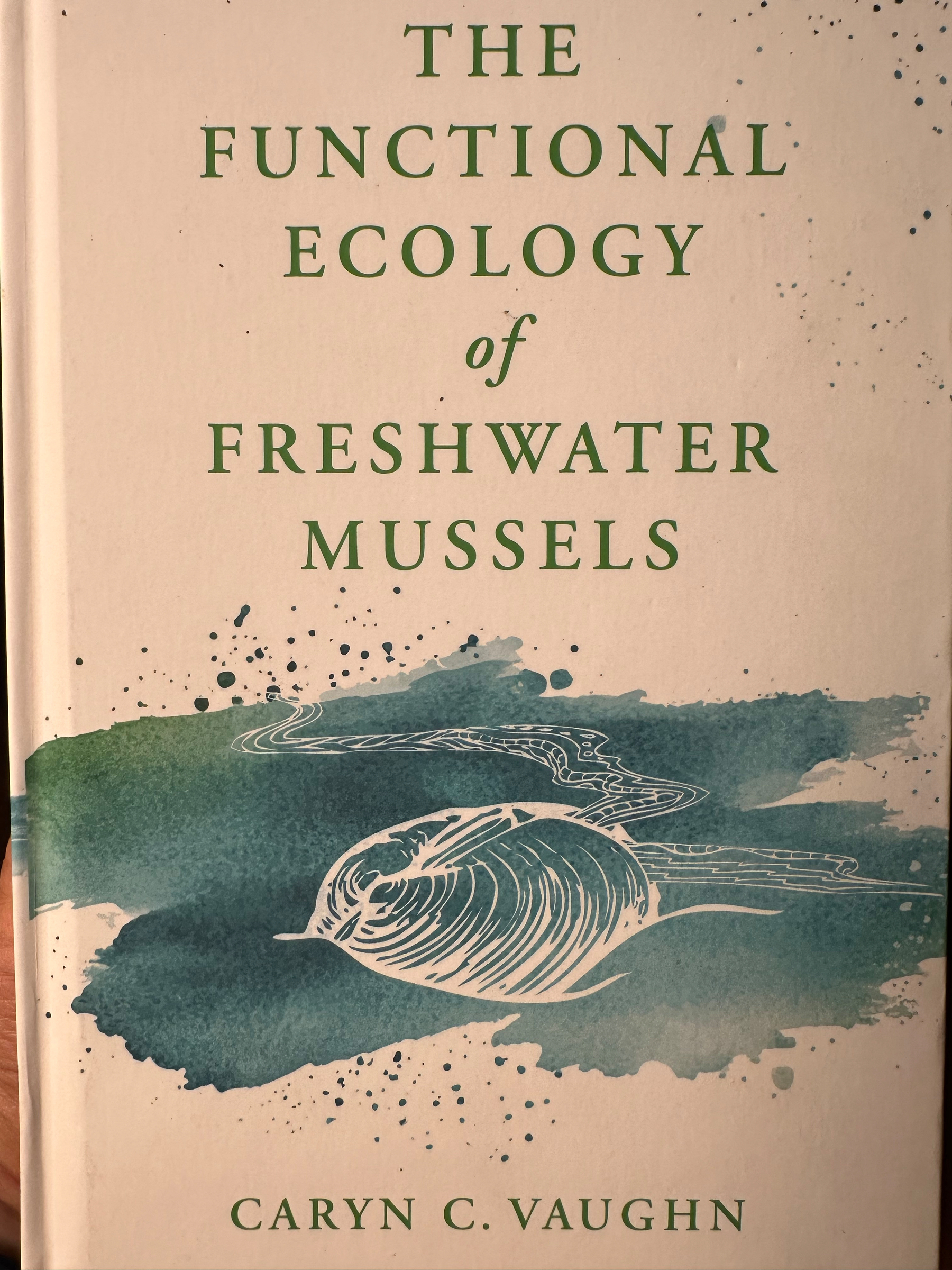 The book titled The Functional Ecology of Freshwater Mussels by Caryn C. Vaughn features a cover design with an artistic illustration of a mussel and stylized water.