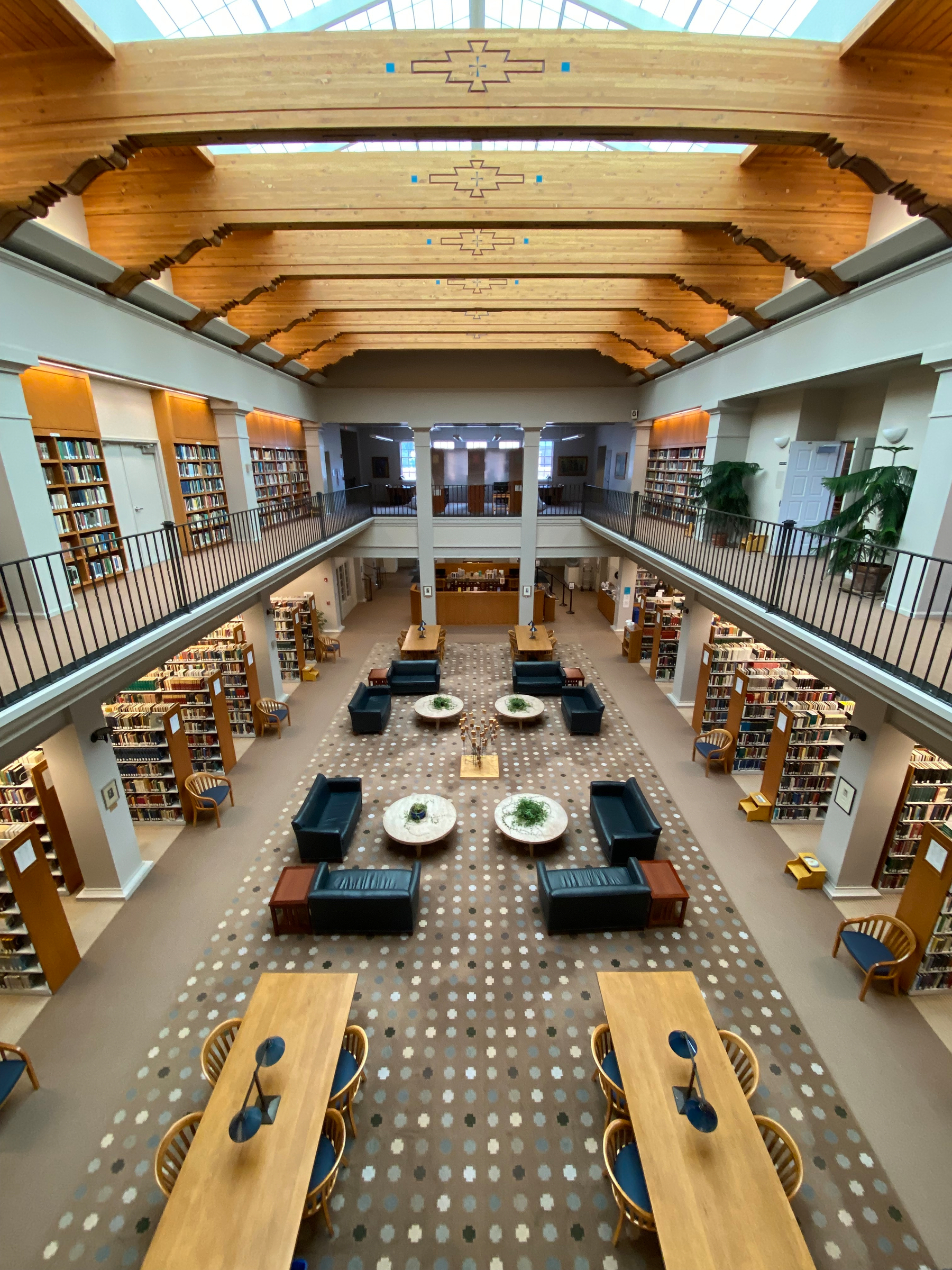 A spacious, well-lit library features wooden beams, multiple bookshelves, comfortable seating areas, and study tables arranged in an organized and inviting manner. St John’s College Meem Library in Santa Fe, New Mexico. This was the site of many of my serendipitous discoveries as a graduate student, and it continues to be the place I most want to return to on each return visit to my alma mater.